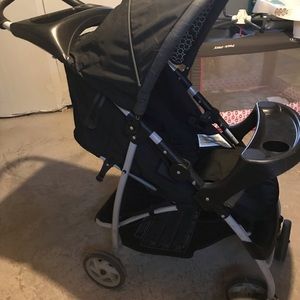 Graco baby stroller black with black & white pattered interior $45